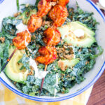 Kale Caesar Salad with Harissa Grilled Shrimp and Nutty Parmesan Crouton Crumbles