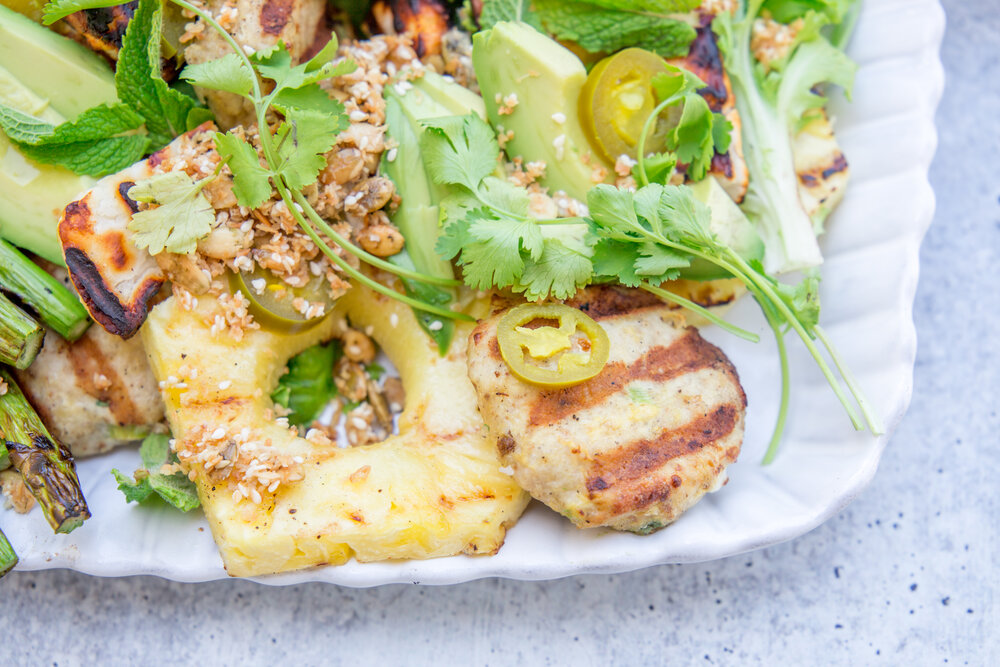 Grilled Ginger-Scallion Chicken Burger Platter with Pineapple, Halloumi, and Coconut Crunch